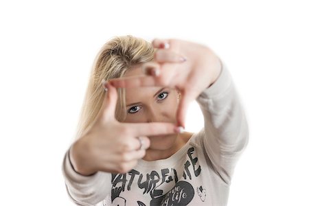 simsearch:694-03694097,k - Young girl looking through her hands with the focus on the face isolated on white Foto de stock - Royalty-Free Super Valor e Assinatura, Número: 400-07244074