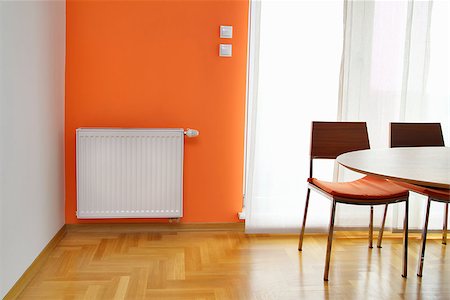 simsearch:400-05721873,k - Heating Readiator on the Orange Wall Stock Photo - Budget Royalty-Free & Subscription, Code: 400-07244193