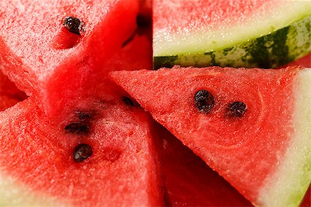 red water melon - Freshly cut waltermelon pieces with black seeds in it Photographie de stock - Aubaine LD & Abonnement, Code: 400-07244522