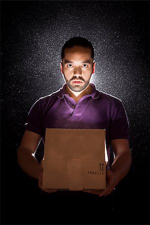 simsearch:614-06169134,k - A young man opens a mysterious and shiny box Stock Photo - Budget Royalty-Free & Subscription, Code: 400-07244536