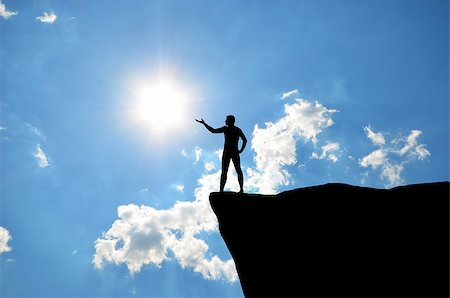 simsearch:400-07249987,k - man on top of the mountain reaches for the sun Stock Photo - Budget Royalty-Free & Subscription, Code: 400-07245239