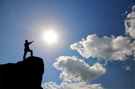 simsearch:400-07249987,k - man on top of the mountain reaches for the sun Stock Photo - Budget Royalty-Free & Subscription, Code: 400-07245245