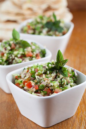 Gourmet Middle Eastern salad Tabbouleh in white bowls Foto de stock - Super Valor sin royalties y Suscripción, Código: 400-07245417