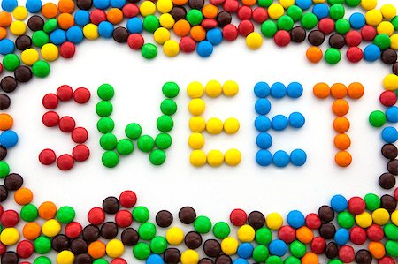 The word sweet, made from colored candies, on white background Stockbilder - Microstock & Abonnement, Bildnummer: 400-07245423
