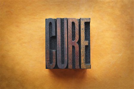 simsearch:400-07325569,k - The word CURE written in vintage letterpress type. Fotografie stock - Microstock e Abbonamento, Codice: 400-07245603