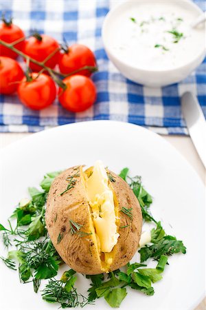 potato skins - Hot baked potato with butter on a white plate Stock Photo - Budget Royalty-Free & Subscription, Code: 400-07246208