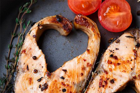 salmon on grill - Pink salmon steak in frying pan with pepper and thyme Stock Photo - Budget Royalty-Free & Subscription, Code: 400-07246226