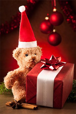 Teddy bear with red santa claus hat and christmas presents Stock Photo - Budget Royalty-Free & Subscription, Code: 400-07246702