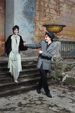 Retro styled fashion portrait of a young couple. Clothing and make-up in 1920s style. Photographie de stock - Aubaine LD & Abonnement, Code: 400-07246995