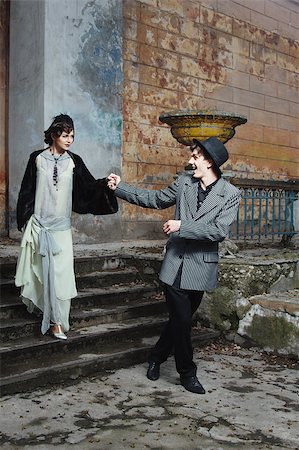 Retro styled fashion portrait of a young couple. Clothing and make-up in 1920s style. Photographie de stock - Aubaine LD & Abonnement, Code: 400-07246996