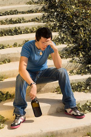sad addiction pictures - Guy trying to drown his worries with alcohol Stock Photo - Budget Royalty-Free & Subscription, Code: 400-07247164