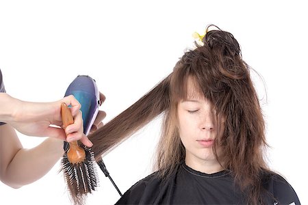 Woman enjoying having her hair blow dried, isolated on white Stock Photo - Budget Royalty-Free & Subscription, Code: 400-07247941