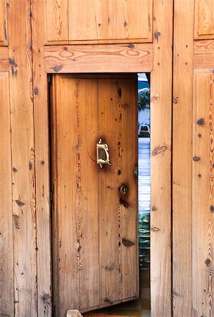 door knobs and keys and keyholes - Old ancient wooden open door Stock Photo - Budget Royalty-Free & Subscription, Code: 400-07248066