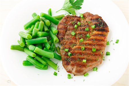 Delicious beef steak with green beans on a plate Stock Photo - Budget Royalty-Free & Subscription, Code: 400-07248076