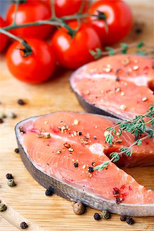 salmon pink - Pink salmon steak on a wooden board with pepper and thyme Stock Photo - Budget Royalty-Free & Subscription, Code: 400-07248227