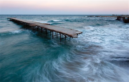 Evening sea storm and ruined pier (Black Sea, Bulgaria). Foto de stock - Super Valor sin royalties y Suscripción, Código: 400-07248220