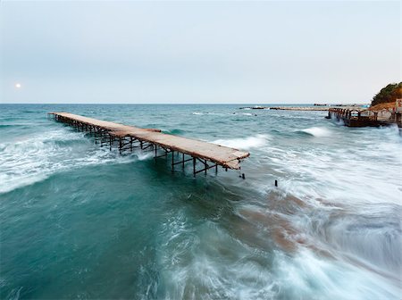 Evening sea surf view, ruined pier and Moon in sky (Black Sea, Bulgaria). Long-time exposition Stock Photo - Budget Royalty-Free & Subscription, Code: 400-07248221