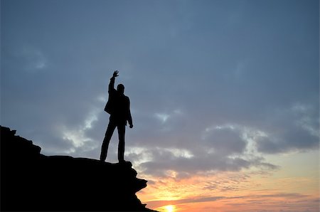 simsearch:400-07249987,k - man on top of the mountain reaches for the sun Stock Photo - Budget Royalty-Free & Subscription, Code: 400-07248680