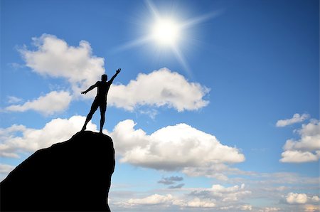 simsearch:400-07249987,k - man on top of the mountain reaches for the sun Stock Photo - Budget Royalty-Free & Subscription, Code: 400-07248696