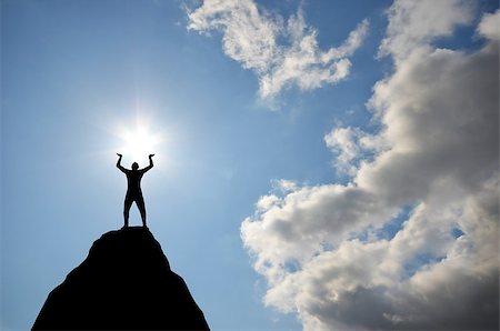 simsearch:400-07249987,k - man on top of the mountain reaches for the sun Stock Photo - Budget Royalty-Free & Subscription, Code: 400-07248709