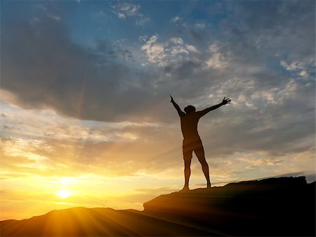 simsearch:400-04043242,k - man on top of the mountain reaches for the sun Photographie de stock - Aubaine LD & Abonnement, Code: 400-07248775