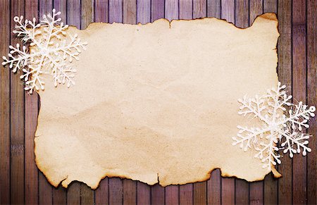 simsearch:400-07179433,k - Old burnt empty paper  and decorative snowflakes Stock Photo - Budget Royalty-Free & Subscription, Code: 400-07248839