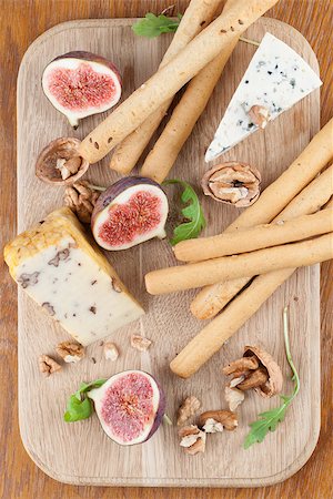 simsearch:400-05682309,k - Cheese board with blue cheese, nut cheese, fresh figs, nuts and grissini Stock Photo - Budget Royalty-Free & Subscription, Code: 400-07249287