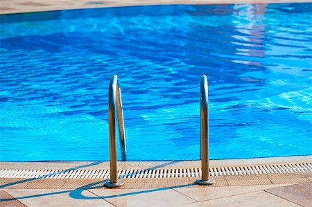 swimming pool sport departure - railing stairs down to the pool with fresh water Stock Photo - Budget Royalty-Free & Subscription, Code: 400-07249396