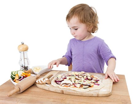 preschooler making fresh pizza on wooden desk. isolated on white background Photographie de stock - Aubaine LD & Abonnement, Code: 400-07249837
