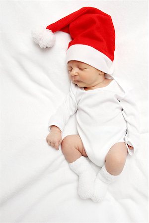 sleeping baby with Santa Claus hat Photographie de stock - Aubaine LD & Abonnement, Code: 400-07243450