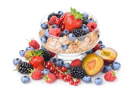 Healthy muesli and fresh berries in glass bowl. Isolated over white background. Stock Photo - Budget Royalty-Free & Subscription, Code: 400-07243558