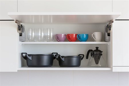 opened cupboard with kitchenware inside Stock Photo - Budget Royalty-Free & Subscription, Code: 400-07243609