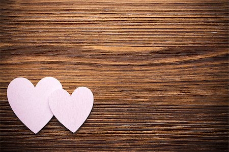 Wood hearts on a wooden background. Fotografie stock - Microstock e Abbonamento, Codice: 400-07243720
