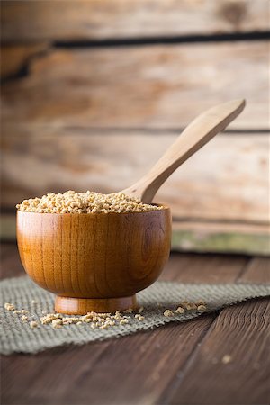 simsearch:400-05328786,k - Soy wooden bowl on a wooden surface, eco product. Fotografie stock - Microstock e Abbonamento, Codice: 400-07243738
