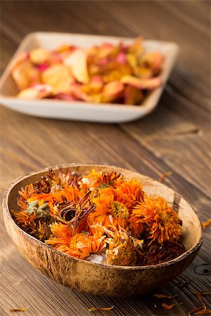 Homeopathic medicine, calendula dry flowers and wooden surface. Stock Photo - Budget Royalty-Free & Subscription, Code: 400-07243739