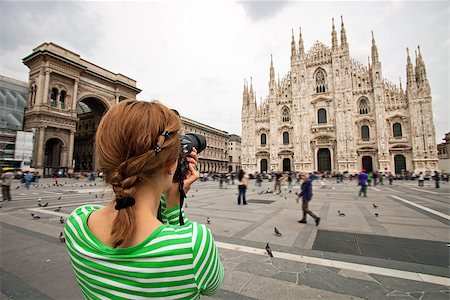 simsearch:400-06173987,k - Young woman taking picture of Duomo di Milano (Milan Cathedral), Milan, Italy, motion blurred people on square Stock Photo - Budget Royalty-Free & Subscription, Code: 400-07243851