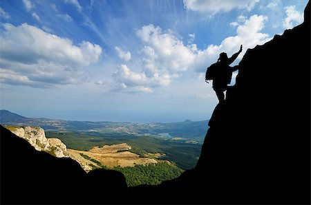 simsearch:400-07208717,k - Silhouette climber conquers mountain peak Photographie de stock - Aubaine LD & Abonnement, Code: 400-07243945