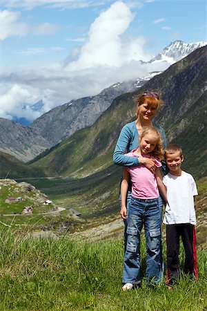 switzerland people on road - Family (mother with children) walk on summer Alps mountain plateau (Switzerland, Passo del San Gottardo) Stock Photo - Budget Royalty-Free & Subscription, Code: 400-07254396