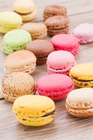 passion fruit - assorted french multicolored  macaroons on wooden table Photographie de stock - Aubaine LD & Abonnement, Code: 400-07254850