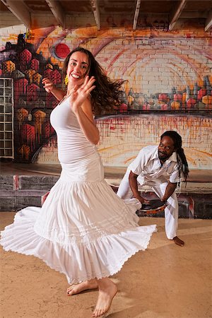 Pretty woman dancing and handsome pandeiro drummer Stock Photo - Budget Royalty-Free & Subscription, Code: 400-07256252