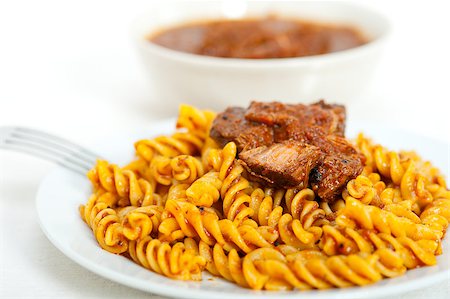 simsearch:400-07955620,k - fusilli pasta al dente with neapolitan style ragu meat sauce very different from bolognese style Photographie de stock - Aubaine LD & Abonnement, Code: 400-07256386