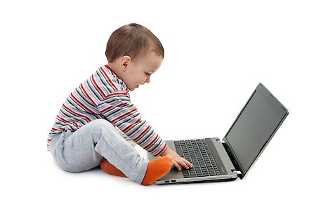 little smiling baby boy with laptop isolated on white background Stockbilder - Microstock & Abonnement, Bildnummer: 400-07257644