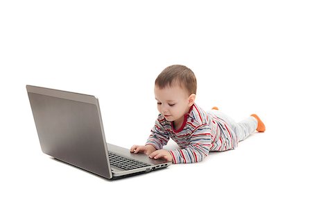 child pushing button on laptop isolated on white background Stockbilder - Microstock & Abonnement, Bildnummer: 400-07257647