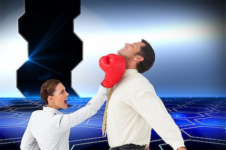 simsearch:400-07258010,k - Composite image of businesswoman hitting a businessman with boxing gloves on white background Foto de stock - Royalty-Free Super Valor e Assinatura, Número: 400-07258018