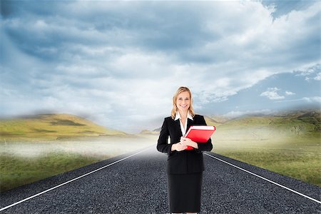 simsearch:400-07258416,k - Composite image of attractive blonde businesswoman smiling and holding folders Stock Photo - Budget Royalty-Free & Subscription, Code: 400-07258403