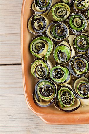 Eggplant and zucchini rolls on baking sheet with hemp seed Stock Photo - Budget Royalty-Free & Subscription, Code: 400-07259268