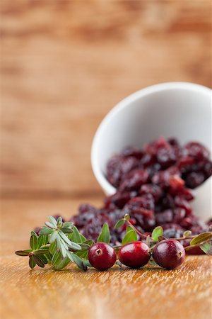 Fresh organic cranberries and a bowl with dried cranberries Stock Photo - Budget Royalty-Free & Subscription, Code: 400-07259273