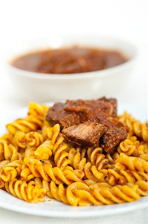 simsearch:400-07955620,k - fusilli pasta al dente with neapolitan style ragu meat sauce very different from bolognese style Photographie de stock - Aubaine LD & Abonnement, Code: 400-07259493