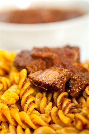 simsearch:400-07955620,k - fusilli pasta al dente with neapolitan style ragu meat sauce very different from bolognese style Stock Photo - Budget Royalty-Free & Subscription, Code: 400-07259538