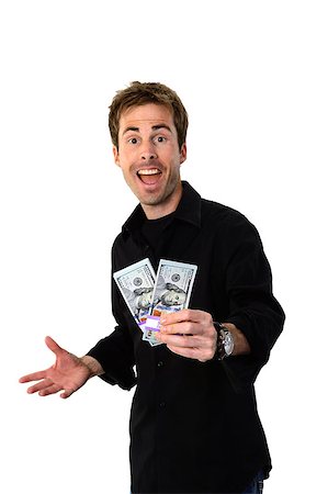 simsearch:700-02265003,k - A young handsome man holding a lot of new hundred dollar bills isolated on white background.  This newly redesigned US currency was released for circulation in October of 2013. Stock Photo - Budget Royalty-Free & Subscription, Code: 400-07250650